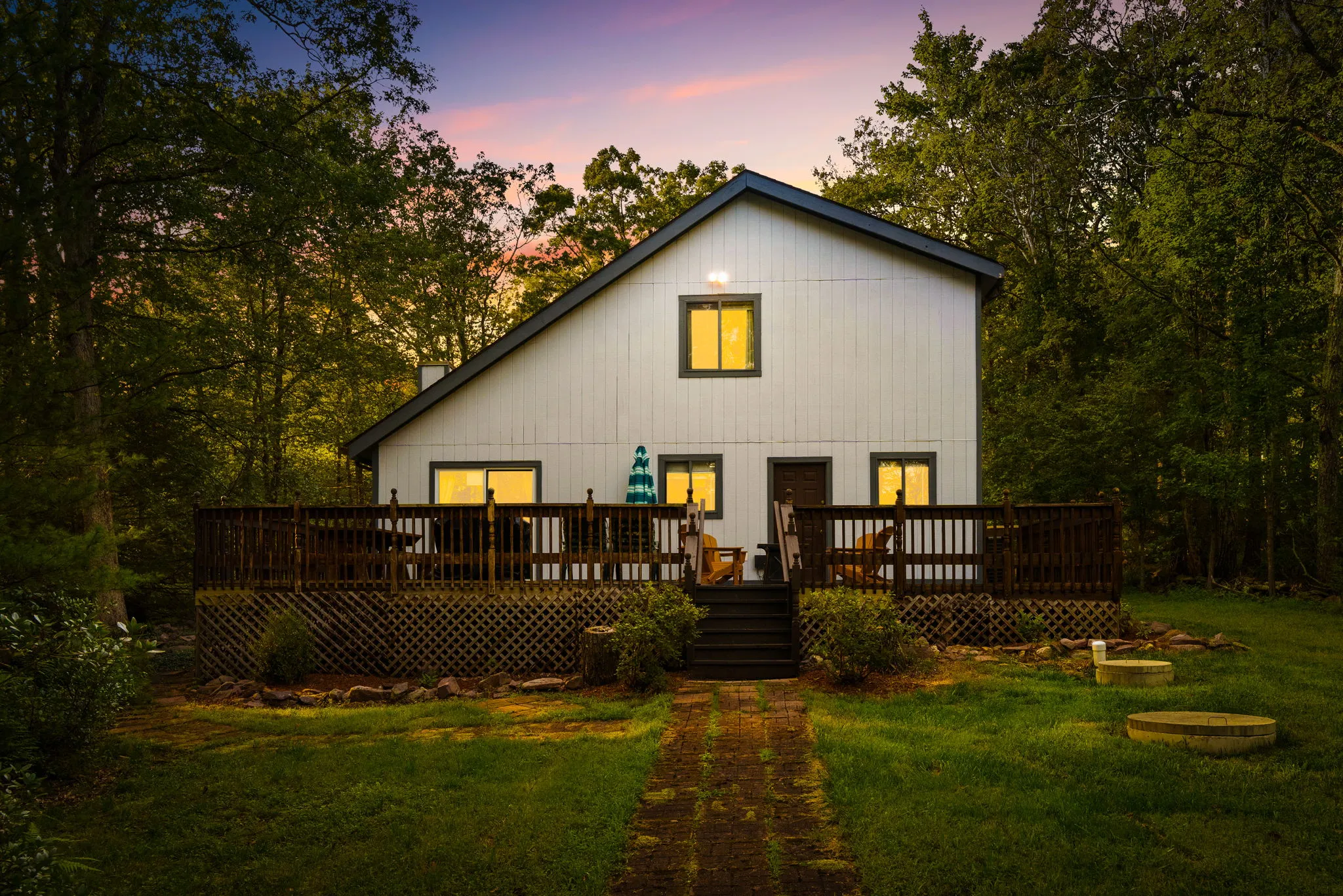 The back of the house and deck at dusk