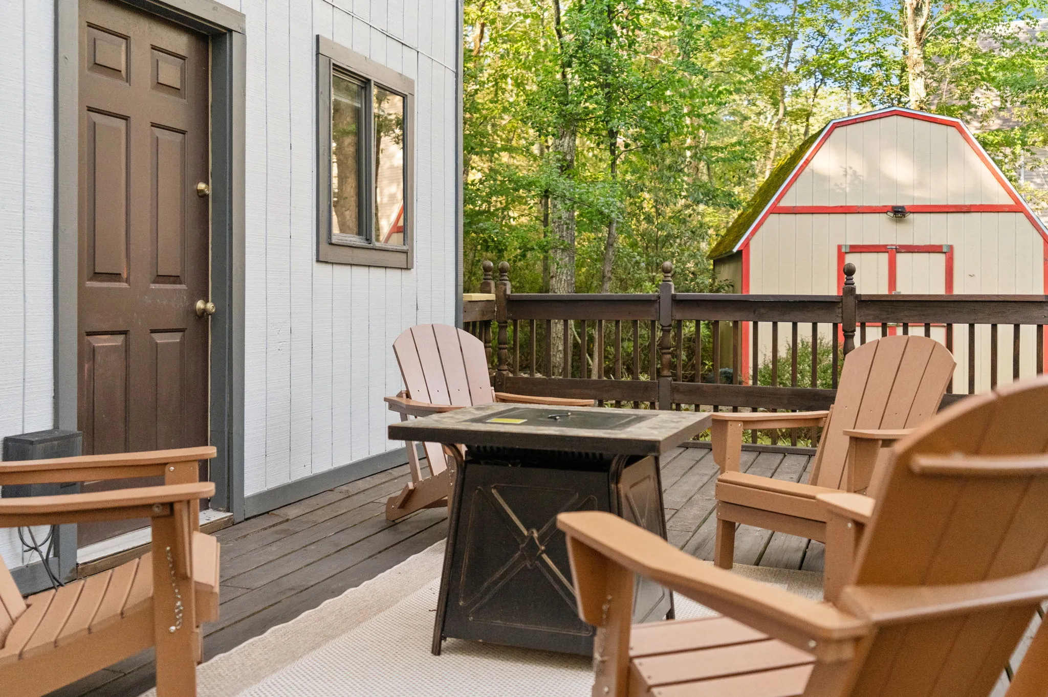 Fire table and Adirondack chairs on the deck